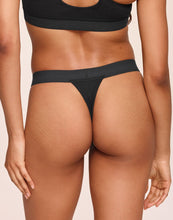 Load image into Gallery viewer, nueskin Tess Rib Cotton Mid-Rise Thong in color Jet Black and shape thong
