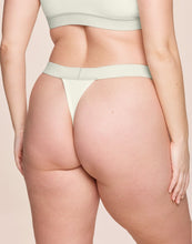 Load image into Gallery viewer, nueskin Tess Rib Cotton Mid-Rise Thong in color Cannoli Cream (Cannoli Cream) and shape thong
